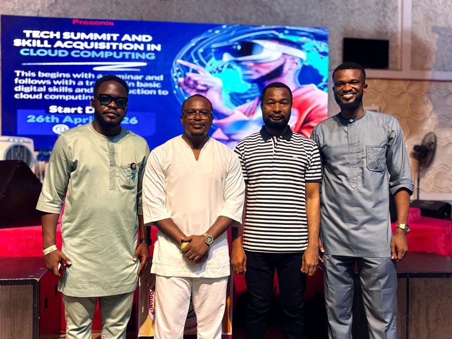 Four speakers posing together in front of the Tech Summit and Skill Acquisition in Cloud Computing banner