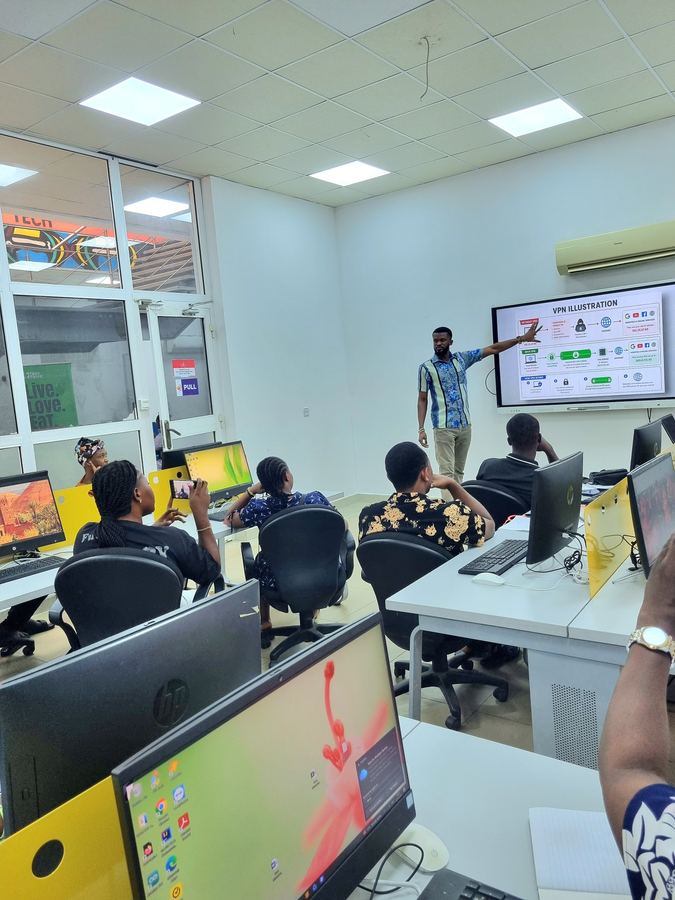 CloudTech Tribe facilitator explaining a VPN illustration to trainees